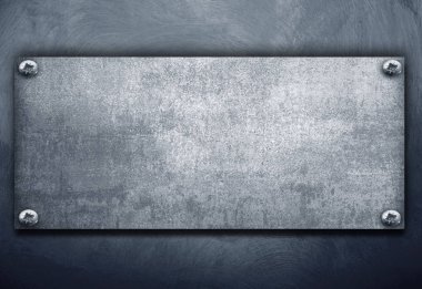 bir vintage arka plan üzerinde endüstriyel metal plaka
