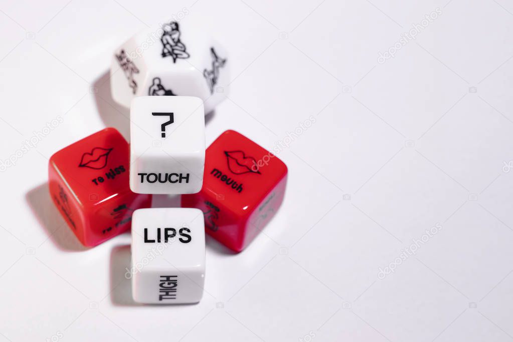 Playing cubes of red and white color for sexual games