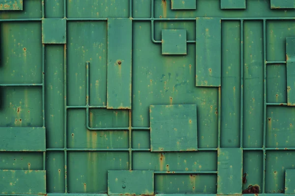 Green iron fence .Full Frame Background of Metal Door Frame Pattern.Green iron fence with a pattern of geometric lines of metal.