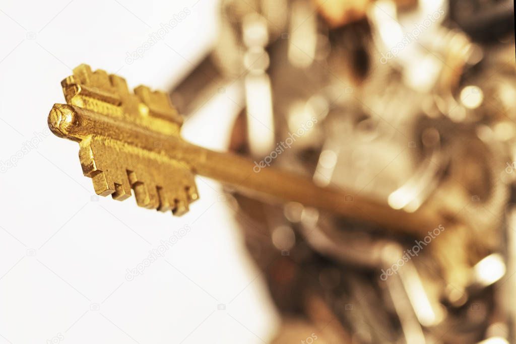Many keys of different sizes. Keys on a white background, close-up. Selective focus, soft focus.