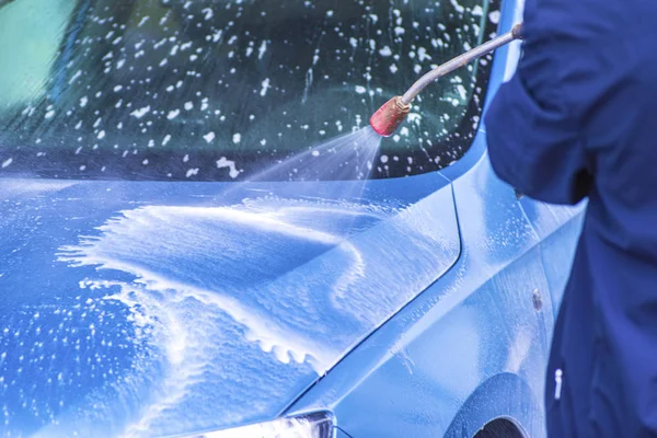 Manual car wash with pressurized water in car wash outside.Cleaning Car Using High Pressure Water. — Stock Photo, Image