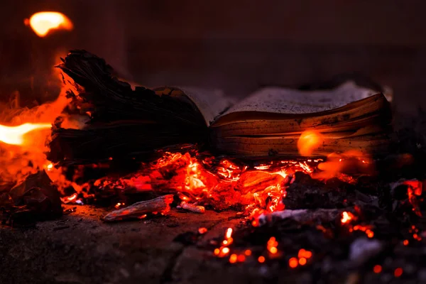Burning books. Books on fire. Burning news. Burning pages of books. Burned thoughts of books.