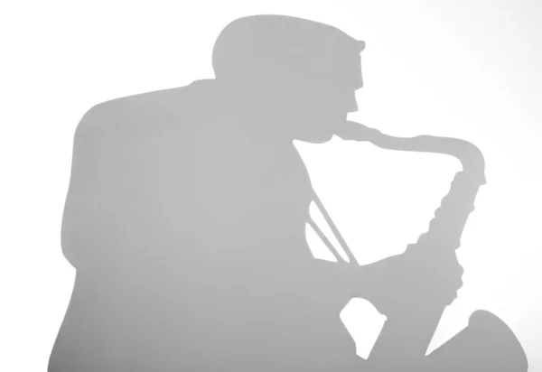 Shadow of a musician on white background — Stock Photo, Image