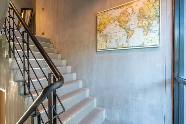 hallway house interior design with stair and world map on the wall in the house or home