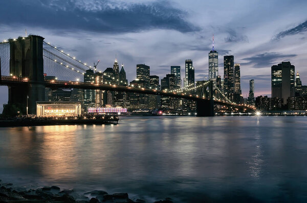 Evening view with Brooklyn Bridge and Manhattan skyline. New York City.