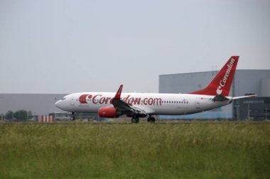 TC-TJN Corendon Airlines Boeing 737-800 landing on Amsterdam Schiphol Airport on the 18L-36R landing strip named Aalsmeerderbaan. clipart