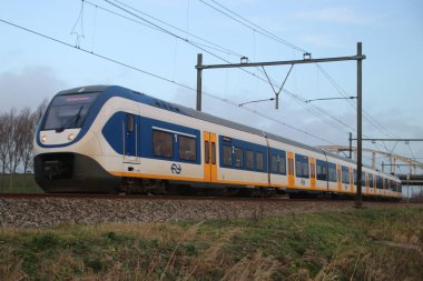 SLT demiryolu adlı parça Gouda ve Lahey arasında Moordrecht geçerken, yerel hafif raylı sistem communter tren türü.