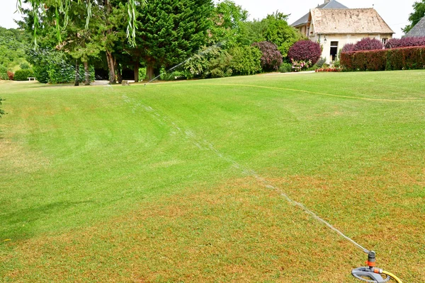 Harquency; France - july 19 2019 :watering — Stock Photo, Image