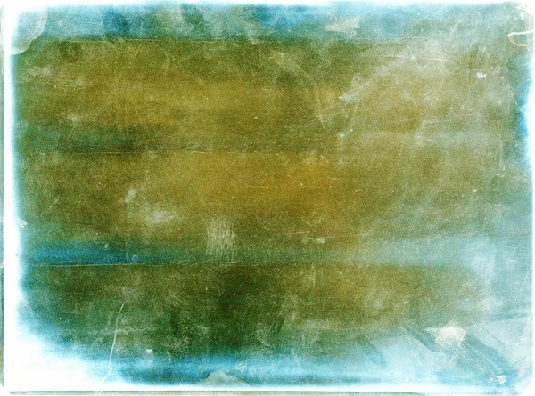 Abstract green blue and yellow colors film texture background with heavy grain, dust and light leak. Large format slide film. Film photography background