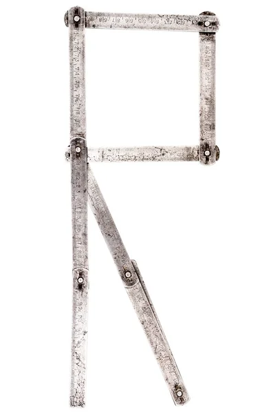 Velho medidor de ferro letra régua R — Fotografia de Stock