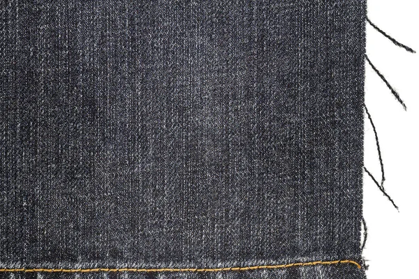 Кусок ткани из темных джинсов — стоковое фото