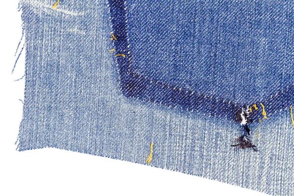 Sepotong kain jeans biru dengan sobekan saku belakang — Stok Foto