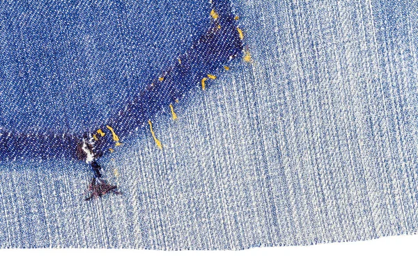 Piece of blue jeans fabric with ripped of back pocket — Stock Photo, Image