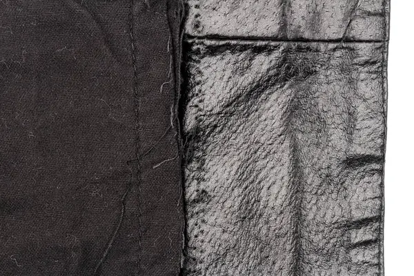 一片凌乱的黑色皮革隔离在白色背景上 折皱的材料质感 — 图库照片