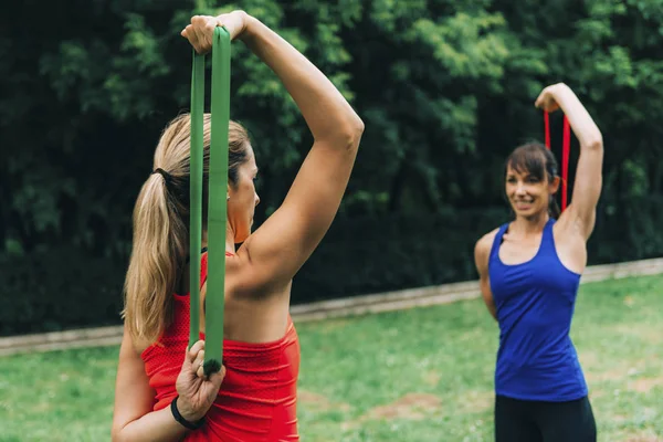 Women Exercising Elastic Bands Green Park — 스톡 사진