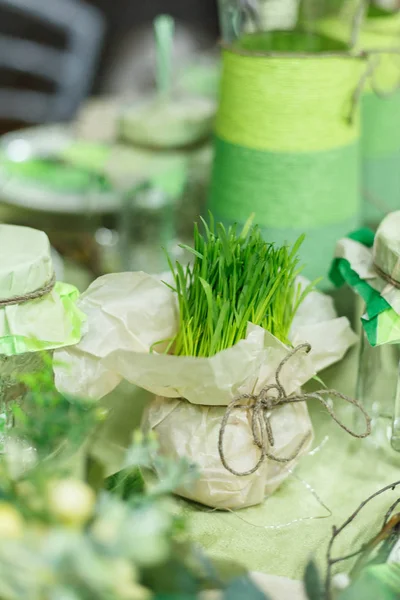 Served table at restaurant. Preparation for banquet. Restaurant table decoration for festive event. Green color