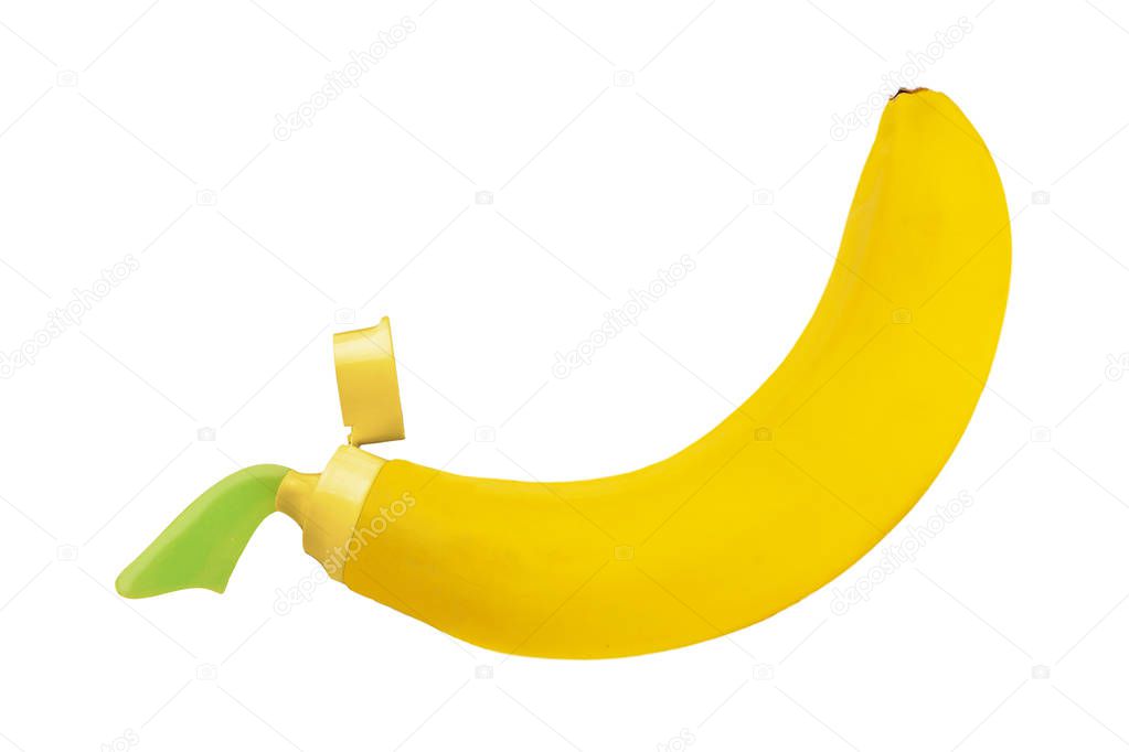 Kontsept zdorov'ye zubov. Zubnaya pasta iz banana na belom fone