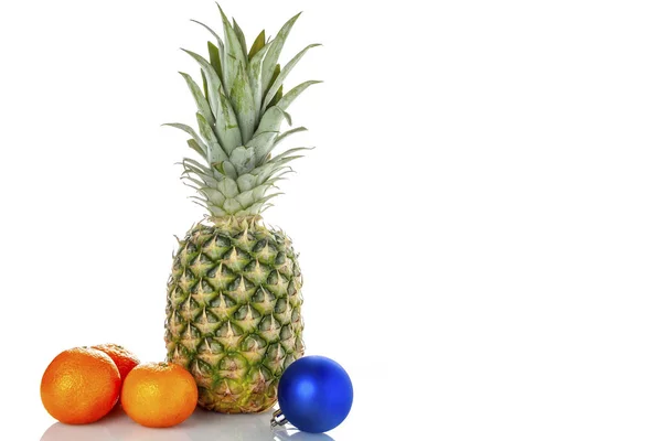 Pineapple, tangerines, Christmas toy on a white background — Stock Photo, Image