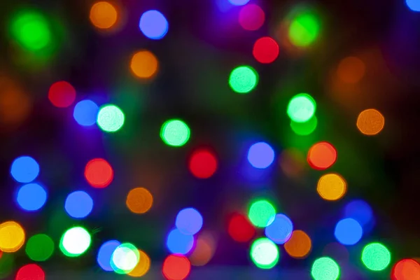 Blurred lights blue background. Glittering christmas effect. Abstract colorful pattern. Shimmering blur spots. Festive design.