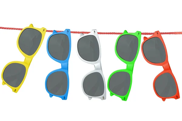 Multi-colored sunglasses hang on a rope. White background, isolate — Stock Photo, Image