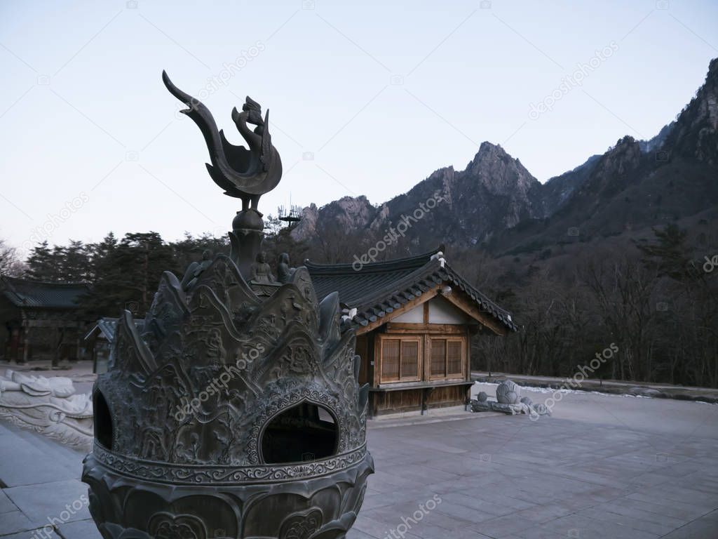 Cock sculpture in in Sinheungsa Temple. Seoraksan National Park. South Korea