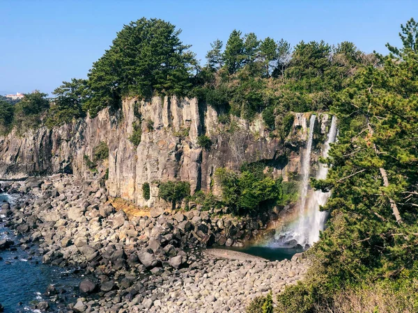 The high waterfall Jeongbang in Jeju island. South Korea