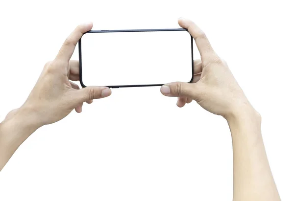 kadınlar bir fotoğraf çekmek için boş ekran ile yatay akıllı telefon tutarak. beyaz arka plan üzerinde izole. Kırpma yolu ile kaydet