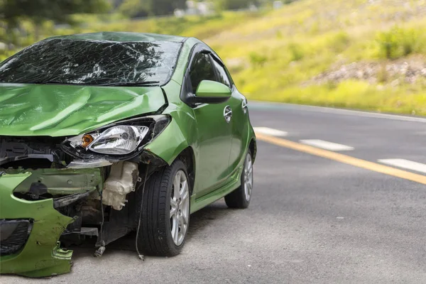 Front of green color car damaged and broken by accident on road parking can not dirve any more — Stock Photo, Image