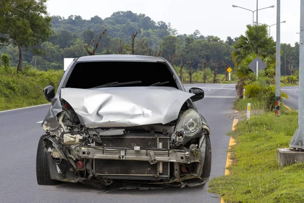 Front of light gray car big damaged and broken by accident on city street parking can not drive any more. With copy space for text or design — Stock Photo, Image