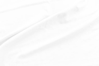 Beyaz pamuk kumaş dokusu arka planı. Dalgalı arkaplanı olan soyut beyaz kumaş. Yumuşak dalgalı beyaz kumaş. Yumuşak odaklanma tekniği. 