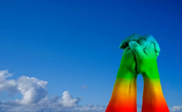Clasped Hands Two Menpainted Rainbow Flag Blue Sky Background Lgbt — Stock Photo, Image