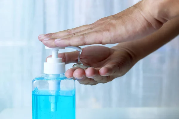 4K Close-up Hand man using hand sanitizer gel . Coronavirus hand sanitizerr gel for clean hands hygiene corona virus . Man using alcohol gel clean hand. Covid-19 concept.