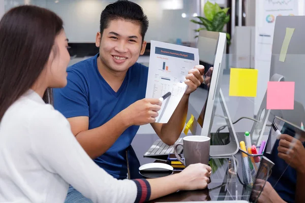 Asian small business start up multiracial working at Private Home Office social distancing among Coronavirus outbreak. Business people show and talking about document chart financial report.