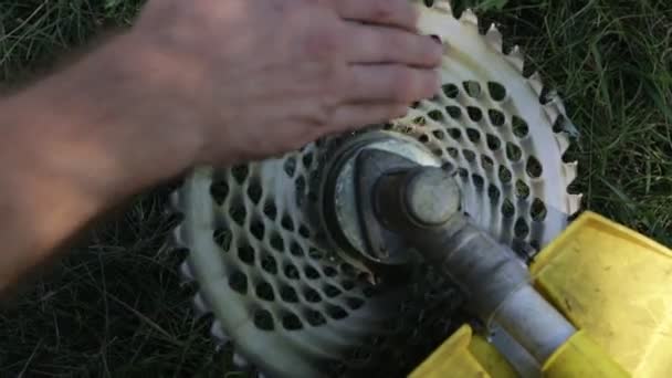 Hand Twists Blade Trimmer Cutting Grass Close — Stock Video