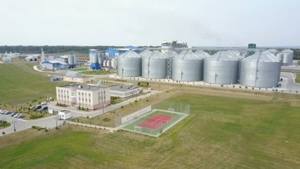 Aerial View Grain Elevators Surrounded Green Fields — Stock Video