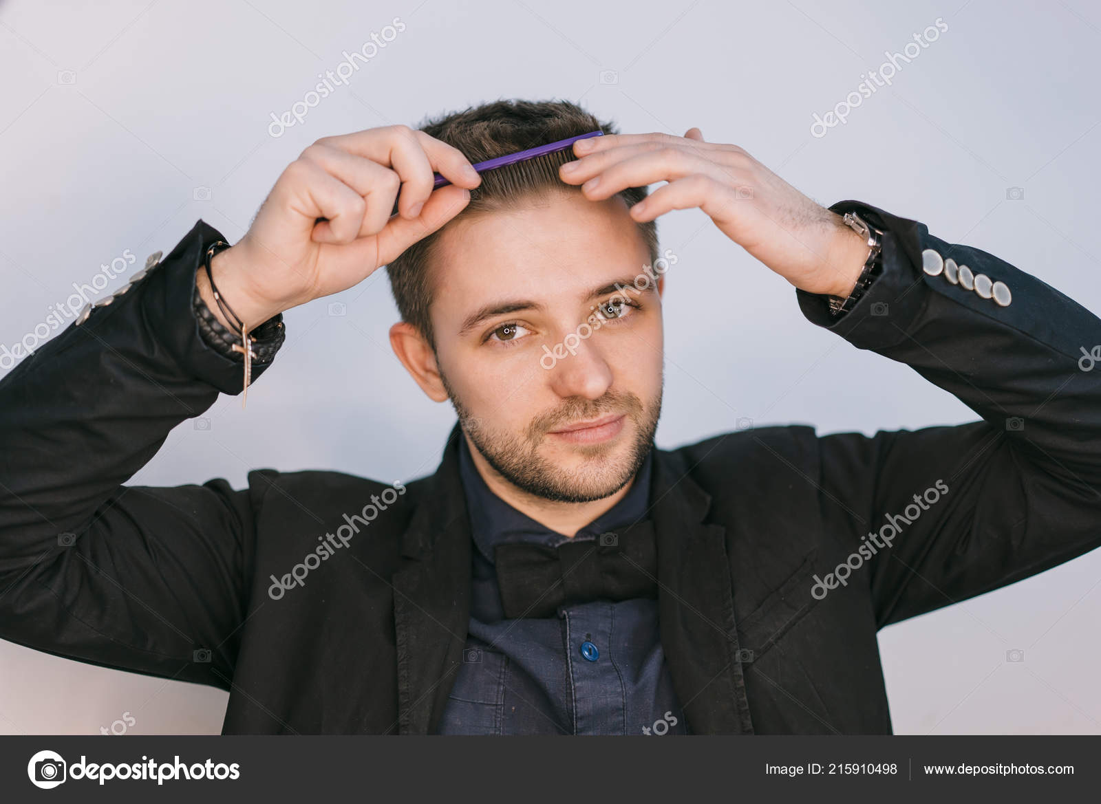 Handsome Man Black Jacket Combs His Forelock Comb White Background