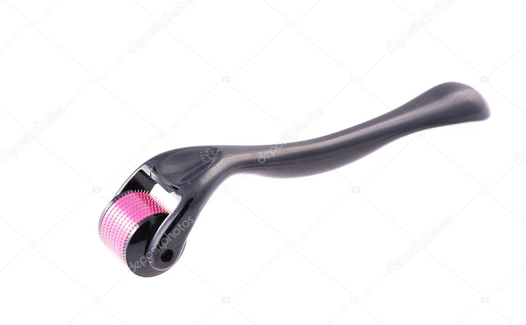 derma roller for skin care with using microneedle therapy on the white background. Close-up
