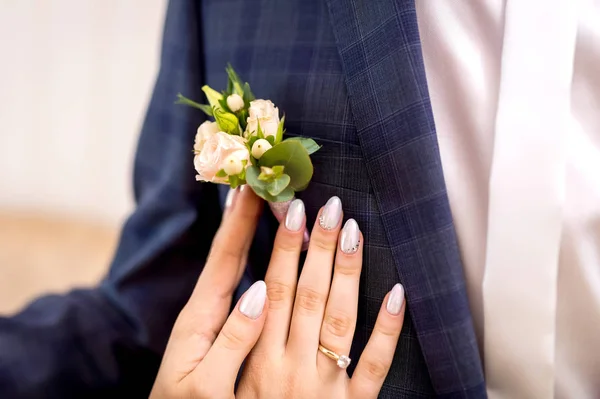 Woman hands embrace groom — Stock Photo, Image