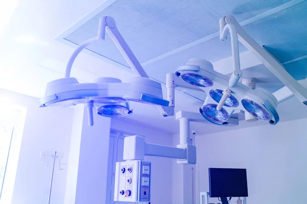 equipment and medical devices in modern operating room take with art lighting and blue filter