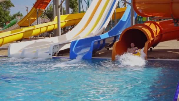 Father Son Sliding Colorful Pipe Water Park Many Slides Blue — Stock Video