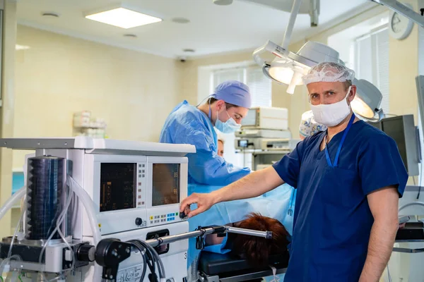 Artificial lung ventilation monitor in the intensive care unit. Doctor with medical equipment. Ventilation of the lungs with oxygen. COVID-19 and coronavirus identification. Pandemic.