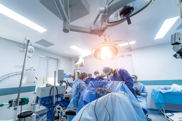 Surgical room in hospital with robotic technology equipment, machine arm surgeon in futuristic operation room. Minimal invasive surgical innovation, medical robot surgery with endoscopy.