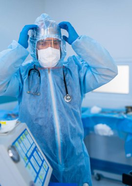 Portrait of a male doctor in safety mask and equipment. Surgeon before neurosurgery operation in hospital. Professional specialist during surgery.