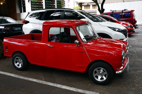 A colored red classic and vintage mini car — Stock Photo, Image