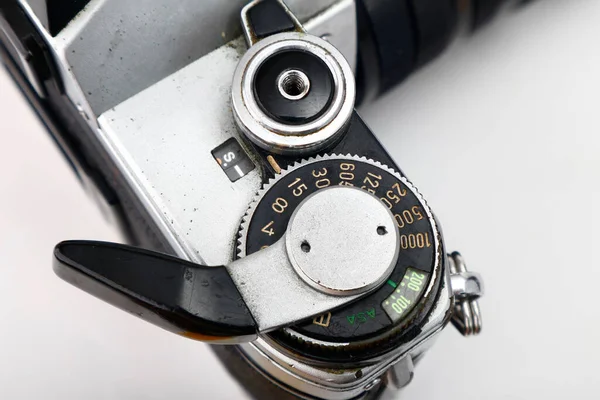 Photo of an old and vintage single lens reflex or SLR film camera isolated on white background.