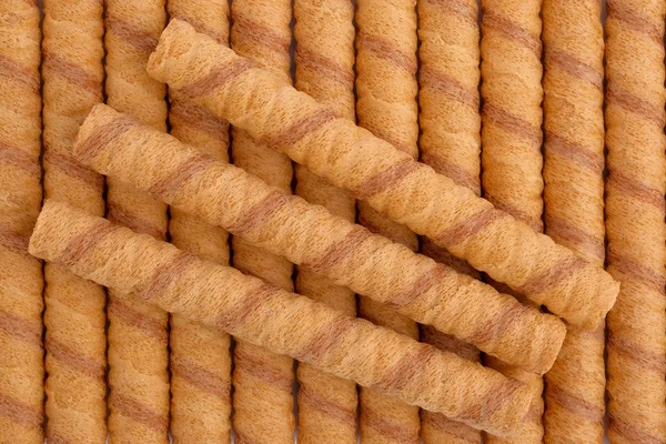 Wafer roll sticks as background, view from above. — Stock Photo, Image