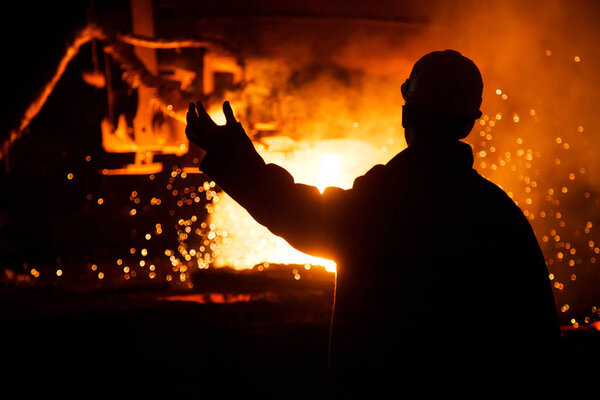Metallurgists at casting ingots in Foundry Shop