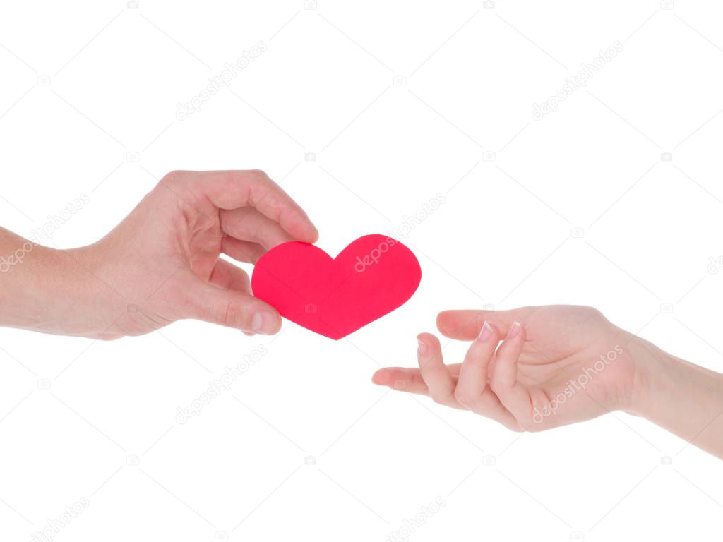 hand holding a red heart.the concept of love, Valentines day, symbol and romantic. red heart for gift