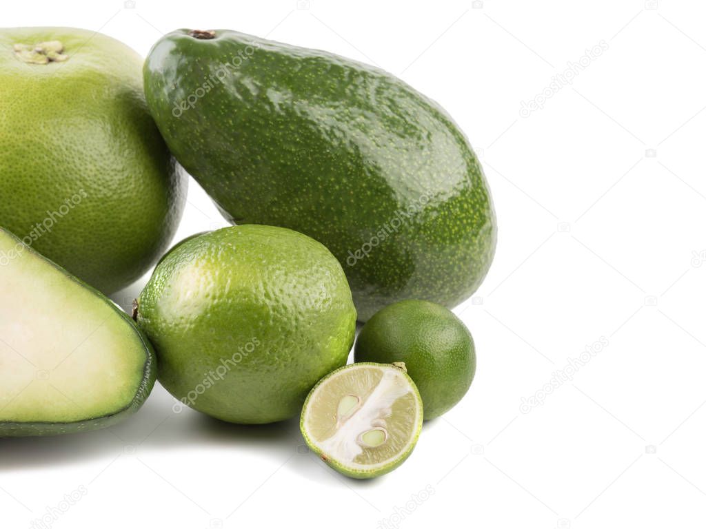 Organic vegetables and fruits. Avocados and tomatoes on a white background