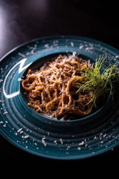 Tasty and healthy food. A beautiful serving of food. Food from the restaurant.Blue plate with food